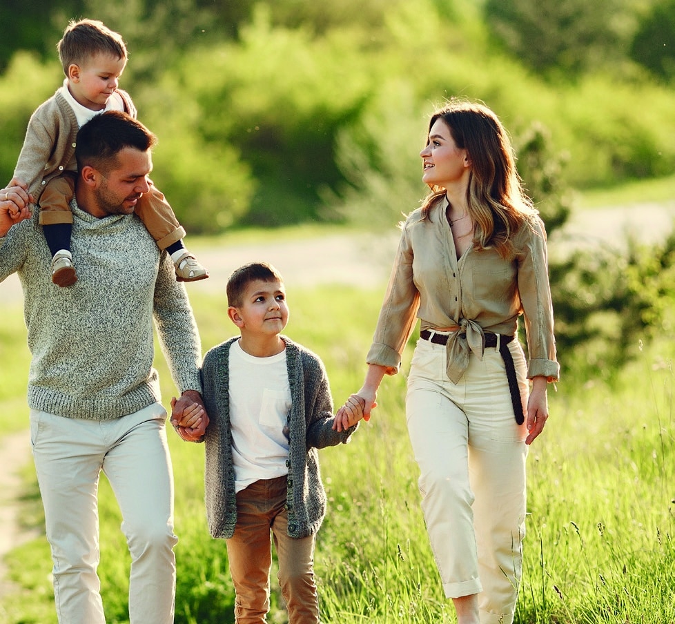 Cute family playing in a summer field